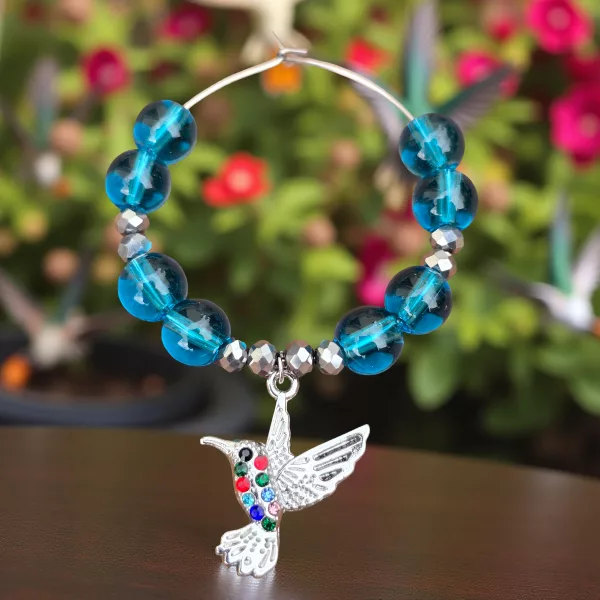 Hummingbird wine glass charm with blue glass beads