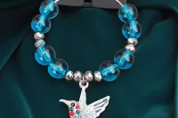 hummingbird wine glass charm with blue glass beads